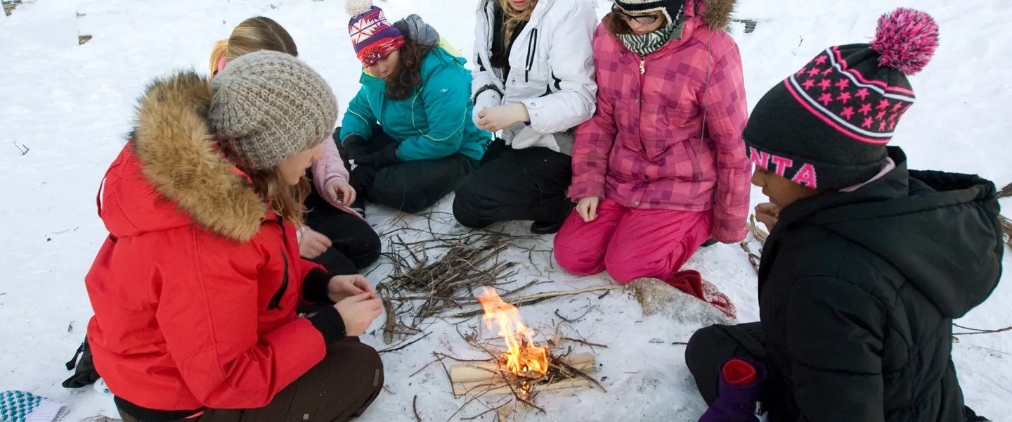 Group of youth girls building fire