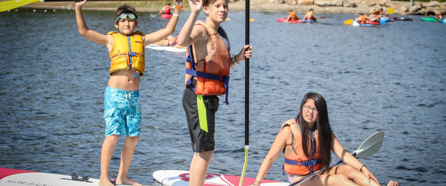 Wanakita campers on paddle boards