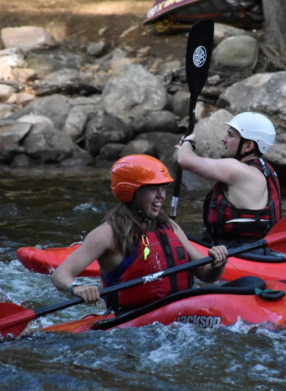 Camper in red kayak