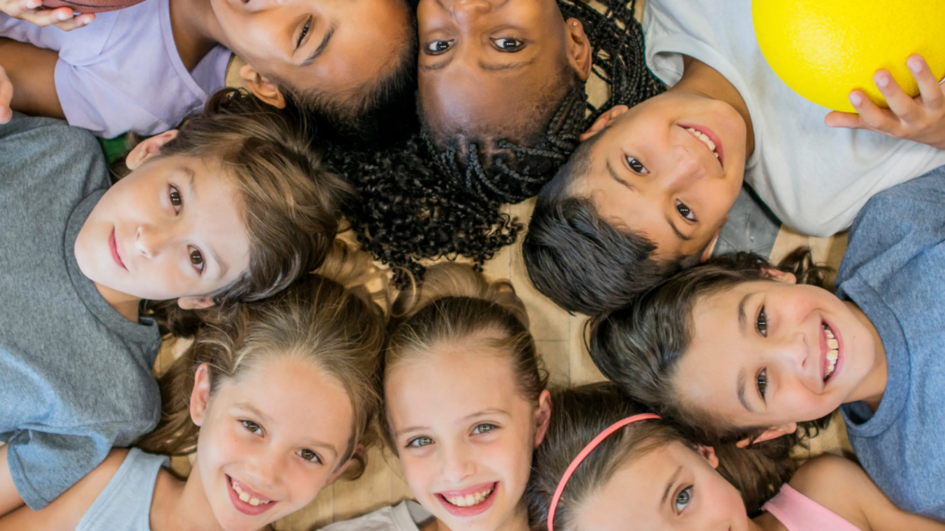 Group of kids laying on floor