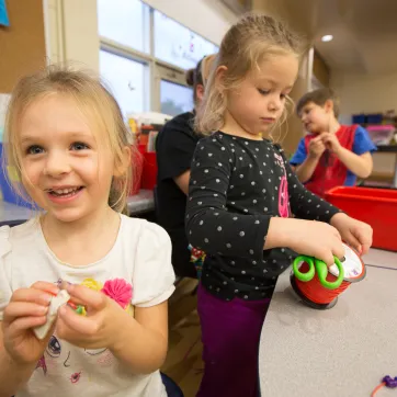 School age girls making crafts