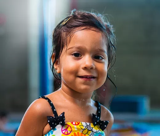 Female child participating in swim lessons
