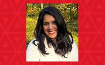 woman in white sweater smiling